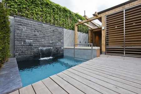 Contemporary-Home-Design-with-Swimming-Pool-with-Waterfall-and-Wooden-Deck-Ideas